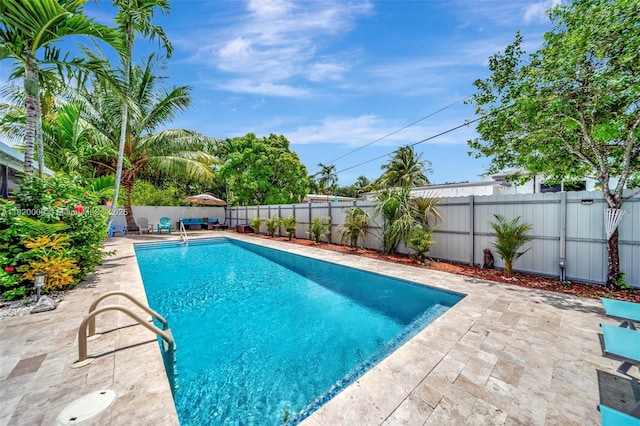 14925 NE 7th Ave, Miami, FL 33161 - view of swimming pool featuring a patio and a fenced backyard