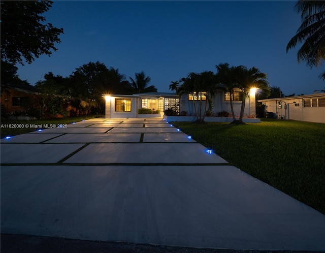 14925 NE 7th Ave, Miami, FL 33161 - view of front facade featuring a yard and driveway