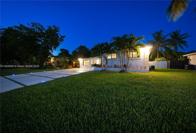 14925 NE 7th Ave, Miami, FL 33161 - view of front of home featuring stucco siding, cooling unit, and concrete driveway