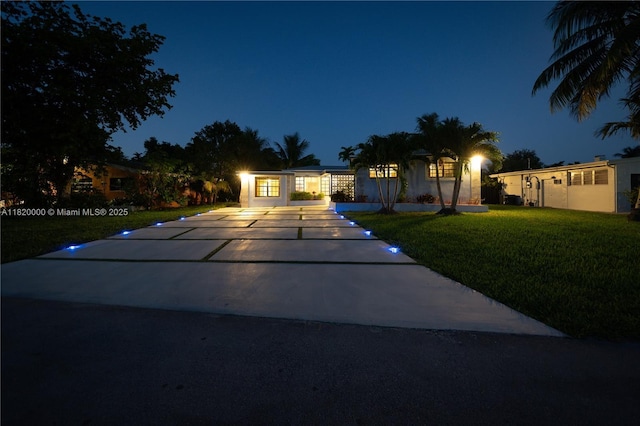 14925 NE 7th Ave, Miami, FL 33161 - view of front of house featuring concrete driveway and a lawn
