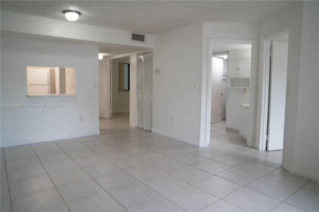 8365 SW 152nd Ave Unit C-104, Miami, FL 33193 - spare room featuring light tile patterned flooring and baseboards