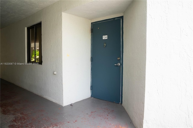 8365 SW 152nd Ave Unit C-104, Miami, FL 33193 - doorway to property with stucco siding