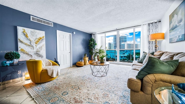 6770 Indian Creek Dr Unit 7B, Miami Beach, FL 33141 - tiled living area with a textured ceiling
