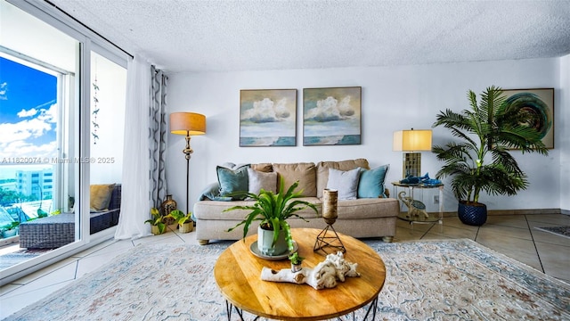 6770 Indian Creek Dr Unit 7B, Miami Beach, FL 33141 - tiled living room featuring a textured ceiling and healthy amount of natural light