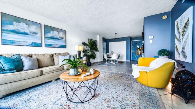 6770 Indian Creek Dr Unit 7B, Miami Beach, FL 33141 - living room with tile patterned flooring and a textured ceiling