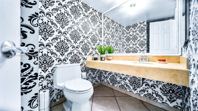 6770 Indian Creek Dr Unit 7B, Miami Beach, FL 33141 - bathroom with wallpapered walls and tile patterned floors