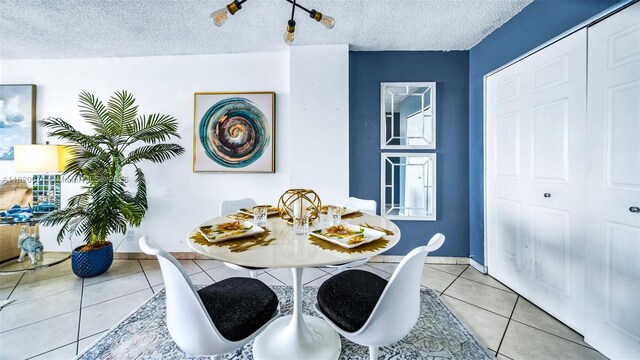 6770 Indian Creek Dr Unit 7B, Miami Beach, FL 33141 - dining space with a textured ceiling and tile patterned floors