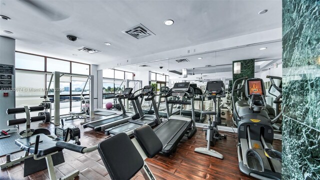 6770 Indian Creek Dr Unit 7B, Miami Beach, FL 33141 - gym featuring wood finished floors, plenty of natural light, expansive windows, and recessed lighting