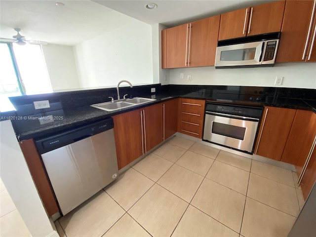 610 Clematis St Unit 721, West Palm Beach, FL 33401 - kitchen with stainless steel appliances, ceiling fan, brown cabinets, a peninsula, and recessed lighting