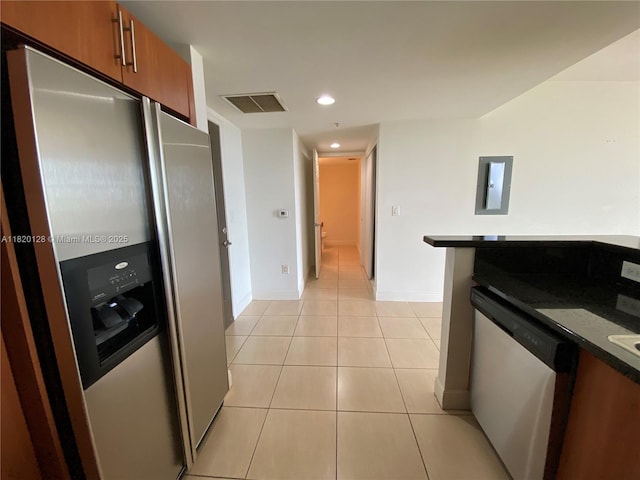 610 Clematis St Unit 721, West Palm Beach, FL 33401 - kitchen with stainless steel fridge with ice dispenser, brown cabinets, electric panel, dishwashing machine, and light tile patterned flooring