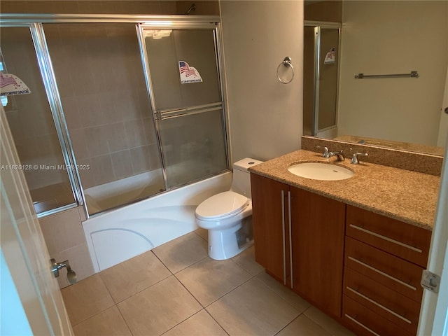 610 Clematis St Unit 721, West Palm Beach, FL 33401 - bathroom featuring vanity, combined bath / shower with glass door, and tile patterned flooring