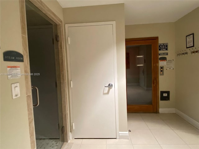 610 Clematis St Unit 721, West Palm Beach, FL 33401 - hall featuring light tile patterned floors and baseboards