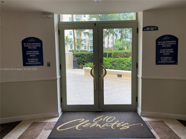 610 Clematis St Unit 721, West Palm Beach, FL 33401 - doorway to outside featuring french doors and tile patterned flooring