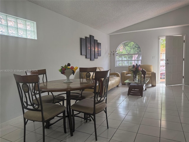 2413 W 73rd Pl, Hialeah, FL 33016 - dining area featuring lofted ceiling, a textured ceiling, and light tile patterned floors