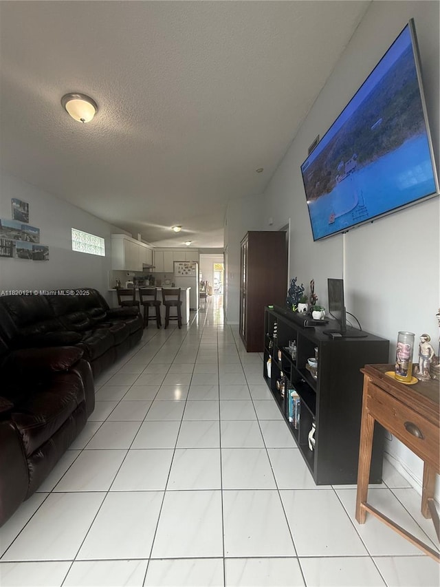 2413 W 73rd Pl, Hialeah, FL 33016 - hallway featuring light tile patterned floors and a textured ceiling