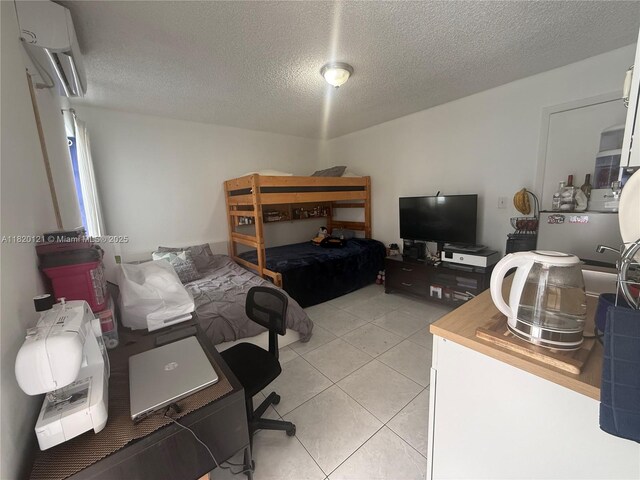2413 W 73rd Pl, Hialeah, FL 33016 - bedroom with a textured ceiling, light tile patterned floors, an AC wall unit, and a desk