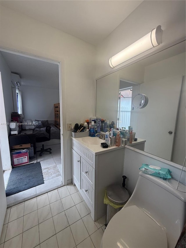2413 W 73rd Pl, Hialeah, FL 33016 - bathroom with vanity, a wall mounted AC, and tile patterned floors