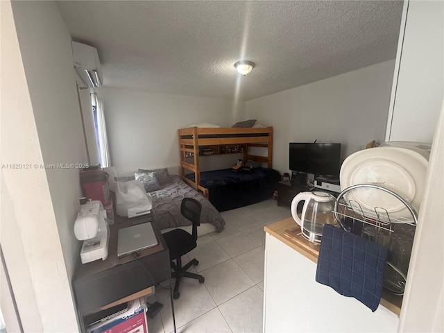 2413 W 73rd Pl, Hialeah, FL 33016 - bedroom with a wall unit AC, light tile patterned floors, and a textured ceiling