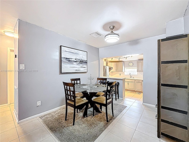 1301 SW 33rd Ter, Fort Lauderdale, FL 33312 - dining area with light tile patterned floors and baseboards