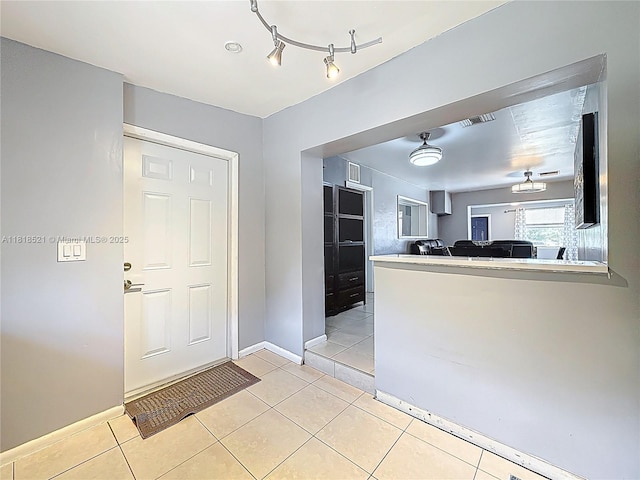 1301 SW 33rd Ter, Fort Lauderdale, FL 33312 - kitchen with light tile patterned flooring and baseboards