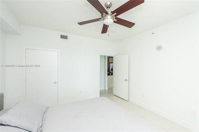 1111 SW 1st Ave Unit 3218-N, Miami, FL 33130 - unfurnished bedroom with ceiling fan and light tile patterned flooring
