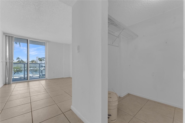 2457 Collins Ave Unit 201, Miami Beach, FL 33140 - walk in closet featuring tile patterned flooring