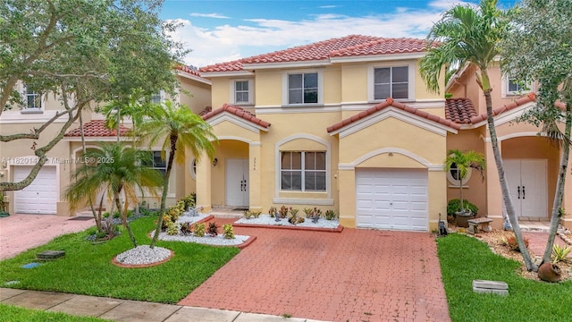 3506 SW 171st Ave, Miramar, FL 33027 - mediterranean / spanish house featuring a tiled roof, decorative driveway, stucco siding, and a garage