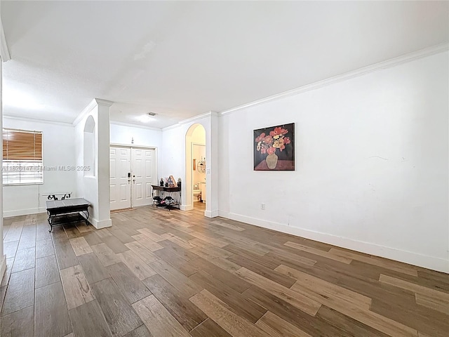 3506 SW 171st Ave, Miramar, FL 33027 - spare room with arched walkways, crown molding, and wood finished floors