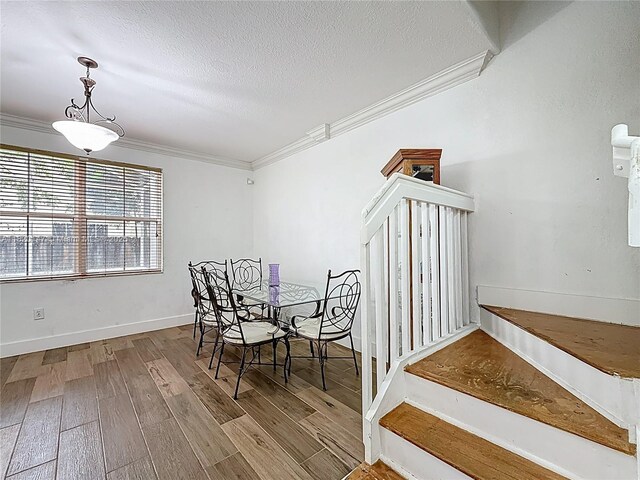 3506 SW 171st Ave, Miramar, FL 33027 - dining area with a textured ceiling, wood finished floors, and crown molding