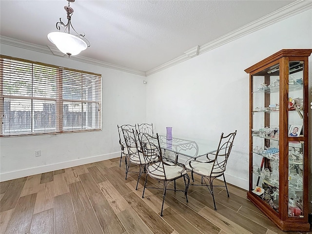 3506 SW 171st Ave, Miramar, FL 33027 - dining room with crown molding, wood finished floors, and a textured ceiling