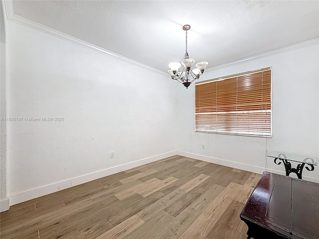 3506 SW 171st Ave, Miramar, FL 33027 - spare room with crown molding, a chandelier, and wood finished floors