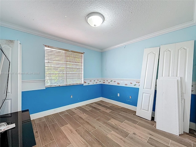 3506 SW 171st Ave, Miramar, FL 33027 - unfurnished bedroom featuring ornamental molding, a textured ceiling, and wood finished floors