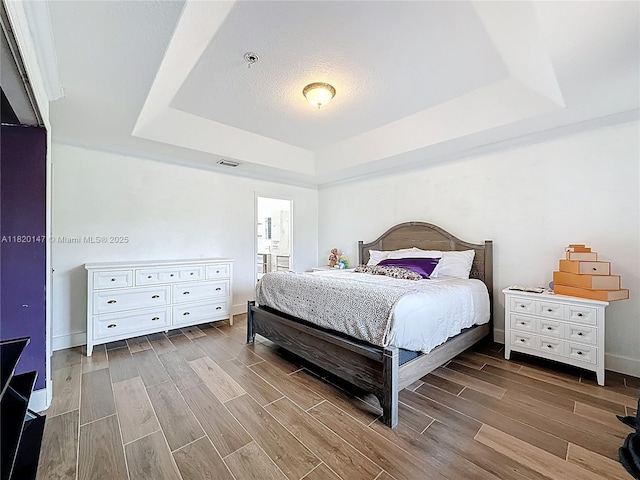 3506 SW 171st Ave, Miramar, FL 33027 - bedroom with a raised ceiling and wood finish floors