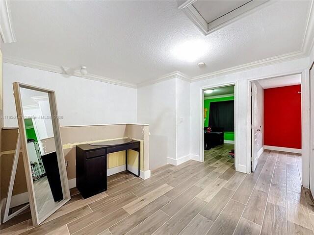 3506 SW 171st Ave, Miramar, FL 33027 - basement with light wood-style floors, ornamental molding, and a textured ceiling