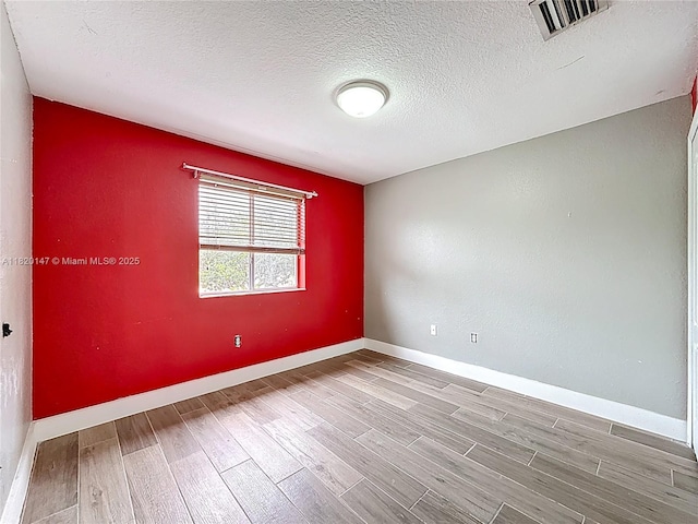3506 SW 171st Ave, Miramar, FL 33027 - spare room with wood finished floors and a textured ceiling