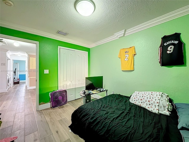 3506 SW 171st Ave, Miramar, FL 33027 - bedroom with ornamental molding, a textured ceiling, wood finished floors, and a closet