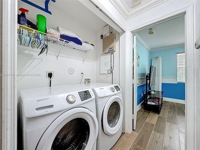 3506 SW 171st Ave, Miramar, FL 33027 - laundry room featuring crown molding, independent washer and dryer, and wood finished floors