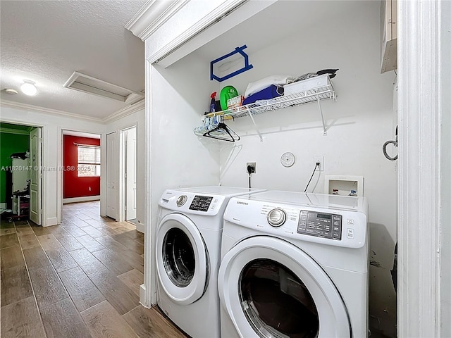 3506 SW 171st Ave, Miramar, FL 33027 - laundry area with separate washer and dryer, ornamental molding, wood finished floors, a textured ceiling, and attic access