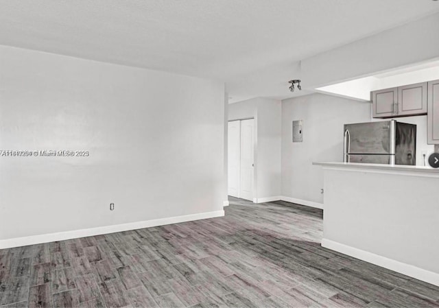 533 Meridian Ave Unit 11, Miami Beach, FL 33139 - unfurnished living room featuring wood finished floors and electric panel