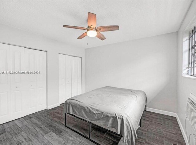 533 Meridian Ave Unit 11, Miami Beach, FL 33139 - bedroom featuring multiple closets, wood finished floors, and a ceiling fan