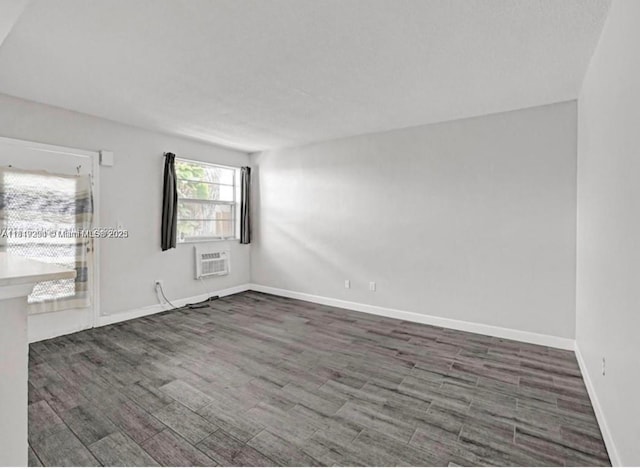 533 Meridian Ave Unit 11, Miami Beach, FL 33139 - empty room featuring a wall mounted AC and wood finished floors