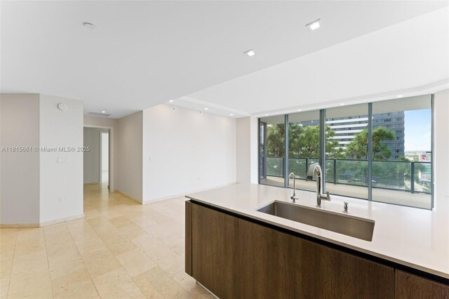 88 SW 7th St Unit 712, Miami, FL 33130 - kitchen with light countertops, dark brown cabinetry, and recessed lighting
