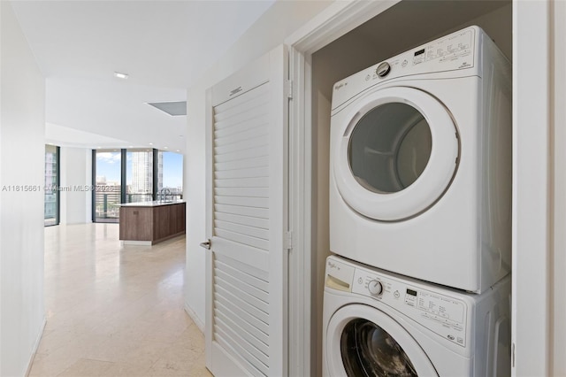 88 SW 7th St Unit 712, Miami, FL 33130 - laundry room featuring stacked washer / drying machine