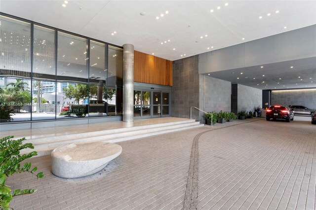 88 SW 7th St Unit 712, Miami, FL 33130 - common area with expansive windows and a high ceiling