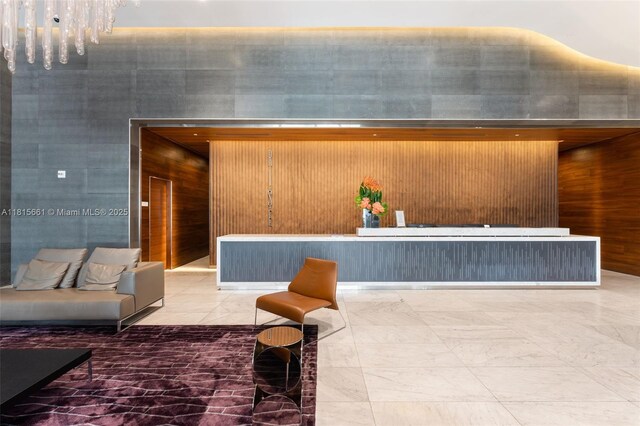 88 SW 7th St Unit 712, Miami, FL 33130 - reception area featuring wood walls and a towering ceiling
