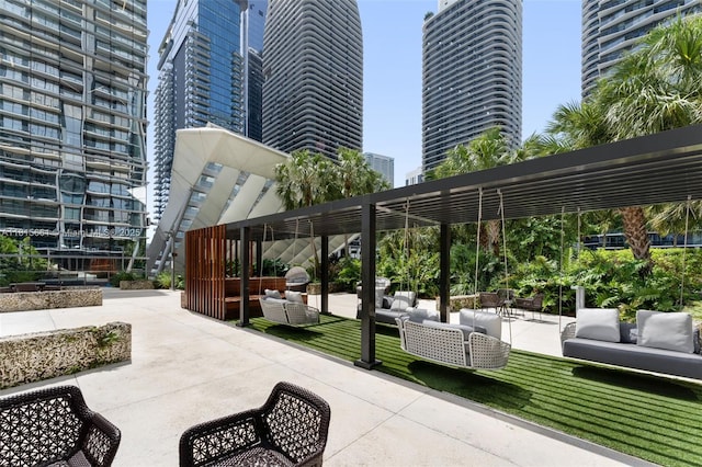 88 SW 7th St Unit 712, Miami, FL 33130 - view of home's community featuring an outdoor living space, a pergola, a patio area, and a view of city