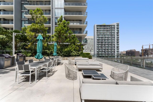 88 SW 7th St Unit 712, Miami, FL 33130 - view of patio / terrace featuring an outdoor living space, a city view, and outdoor dining space