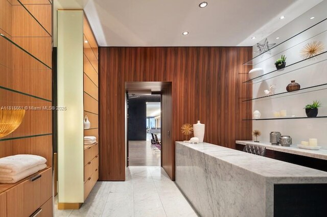 88 SW 7th St Unit 712, Miami, FL 33130 - reception with recessed lighting and wooden walls