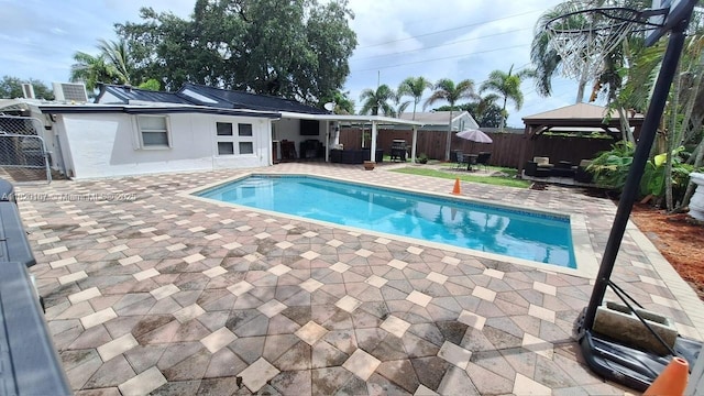 6810 Douglas St, Hollywood, FL 33024 - view of pool featuring a gazebo, a patio area, a fenced backyard, and an outdoor hangout area