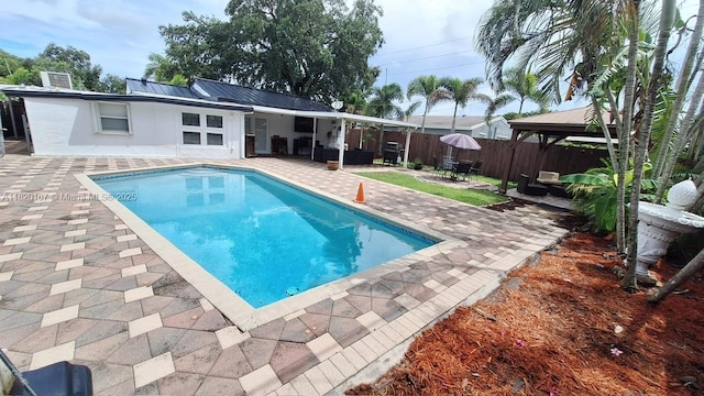6810 Douglas St, Hollywood, FL 33024 - view of swimming pool with a gazebo, a patio, a fenced backyard, and outdoor lounge area